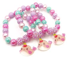 These adorable bracelets are the perfect favor for your little one's Narwhal party!  Each bracelet features a resin narwhal charm, resin rhinestone beads and an assortment of bright pink, light pink, light cyan and lavender 10mm acrylic beads strung with durable stretch cord. Each bracelet will arrive individually packaged in organza bags.  Please select the number of bracelets and bracelet size needed from the drop down menus.  * Estimated delivery dates are calculated by Etsy using the most op Handmade Kawaii Bracelets For Birthdays, Kawaii Pink Bracelet For Party, Kawaii Beaded Bracelets As A Gift, Pink Novelty Plastic Bracelets, Adjustable Multicolor Kawaii Beaded Bracelets, Pearl Jewelry Gift, Light Cyan, Ocean Birthday, Cardboard Jewelry Boxes