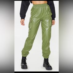 Give Your Look A Serious Edge With These Sweatpants Doll. Featuring A Khaki Faux Leather Material With Pocket Detailing And An Elasticated Waistband, We're Obsessed. Team These With A Cropped Hoodie, Oversized Coat And Lace-Up Boots For A Look We're Loving. Length Approx 77cm/30.5" (Based On A Sample Size Uk 8) Model Wears Size Uk 8/ Eu 36/ Aus 8/ Us 4 Casual Faux Leather Cargo Pants For Streetwear, Faux Leather Bottoms With Pockets For Winter, Utility Faux Leather Pants With Pockets, Casual Leather Pants With Cargo Pockets For Fall, Winter Faux Leather Bottoms With Pockets, Faux Leather Cargo Pants For Fall Streetwear, Casual Leather Pants With Side Pockets For Fall, Utility Leather Cargo Pants For Fall, Fall Utility Leather Pants In Cargo Style