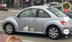 a car with hello kitty stickers on the side