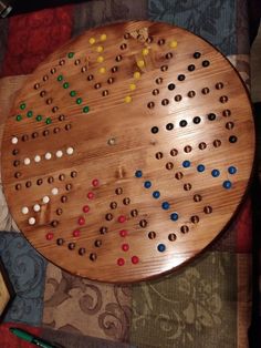 a wooden board game sitting on top of a table