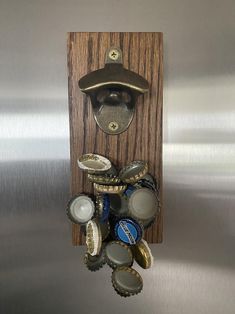 a bottle opener mounted to the side of a wall with lots of bottles in it