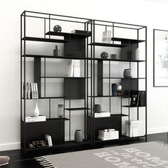 a black and white bookcase with books on it's sides in a living room