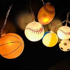 lighted sports balls hanging from string lights