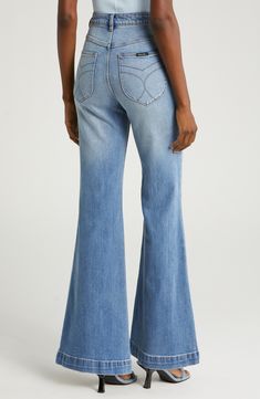 A high-rise waist and flared legs dial up the throwback charm of comfy organic cotton–blend jeans finished with a faded, vintage-inspired wash. 31" inseam, 24" leg opening; 11 1/2" front rise; 15 1/2" back rise (size 29) Zip fly with button closure Five-pocket style 99% organic cotton, 1% elastane Machine wash, line dry Imported Medium Wash High-waist Flares With Five Pockets, High Waist Medium Wash Flares With Five Pockets, High-rise Medium Wash Flares With Five Pockets, Mid-rise Medium Wash Relaxed Fit Flare Jeans, Casual High Rise Flares In Medium Wash, Casual High Rise Medium Wash Flares, High Rise Cotton Flares In Medium Wash, High Rise Medium Wash Cotton Flares, Retro High Rise Flare Jeans With Frayed Hem