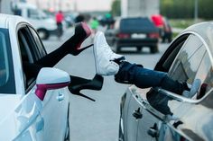 a person sticking their foot out of a car window