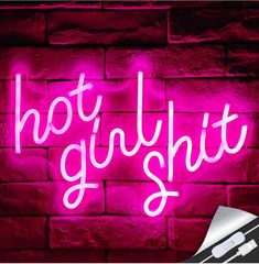 a neon sign that says hot glught on a brick wall