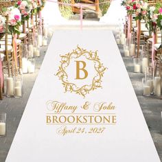 a wedding aisle decorated with candles and flowers