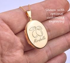 "Custom engraved 14K gold plated over sterling silver oval locket,memorial oval locket,anniversary gift,remembrance photo locket,Valentine's day gift,anniversary gift 1. a large (1 micron) gold plated over sterling silver locket (27 x 20 mm, 5 mm thick, 5.0 grams)     It comes with both sides plain and can be custom-engraved with text or simple graphics.  (please use the pulldown menu to select - \" .... 1 engrv .. \" means 1 side engraved) 2. There are two photo slots inside. Photo insertion service is available (please select the right pulldown option - example \" ... 1 photo\" means/pays for 1 photo inserted by me). If photo service is selected, please send me an ETSY conversation with your photo(s) attached. 3. a 14K gold filled chain closed with a lobster clasp. 4. an optional custom Gold Oval Locket Necklace As A Gift, Gold Oval Locket Necklace For Anniversary, Personalized Gold Locket Necklace With Oval Pendant, Gold Oval Locket Necklace For Keepsake, Gold Oval Link Locket Necklace For Anniversary, Gold Oval Jewelry For Personalized Gift, Oval Gold Jewelry For Personalized Gift, Rose Gold Oval Locket Necklace, Personalized Oval Link Locket Necklace As Gift