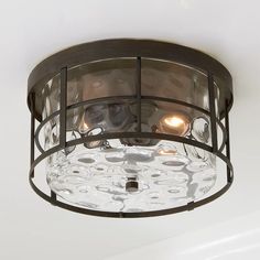 a close up of a light fixture on a ceiling