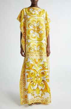 A yellow-and-brown print inspired by hand-painted majolica tiles enlivens this silk dress crafted in a flowy caftan-inspired silhouette. Slips on over head Bateau neck Sleeveless Side slits 100% silk Dry clean Made in Italy Designer Clothing Elegant Yellow Kaftan For Vacation, Yellow Silk Dresses With Printed Motifs, Luxury Yellow Silk Dresses, Yellow Silk Bohemian Dress, Silk Multicolor Kaftan With Vibrant Print, Elegant Printed Silk Kaftan, Silk Kaftan With Multicolor Vibrant Print, Luxury Yellow Art Silk Dress, Elegant Yellow Silk Kaftan