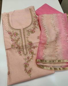 Item Overview ATHARVA Hand Embroidered Salwar Kameez in Light Peach w/ Hand Embroidered Neck/Gota Patti & Border Dupatta/Customized Stitching/Wedding/ Dno. CH Fabric: * Shirt Chanderi 2.5 Mts, Light Peach Jaal Embroidery * Dupatta: Pure Chiffon Chinnon Dupatta with Gota Patti work 2.5 Mts. * Bottom Santoon Silk 2.5 Mts. Excusive Hand Embroidered Party Wear Punjabi Suit. Customization: * Fabrics: Designs Can be made in different Fabrics. * Stitching Available Care: * Dry Clean/ Avoid direct Ironi Semi-stitched Pink Lawn Suit With Dabka Work, Peach Resham Embroidery Traditional Wear For Festive Occasion, Festive Peach Traditional Wear With Resham Embroidery, Pink Raw Silk Salwar Kameez For Eid, Pink Raw Silk Bollywood Salwar Kameez, Pink Bollywood Raw Silk Salwar Kameez, Semi-stitched Peach Zari Work Traditional Wear, Pink Unstitched Suit For Eid Wedding, Peach Semi-stitched Traditional Wear With Zari Work