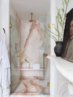 a bathroom with marble floors and walls