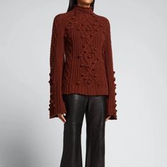 Presented In A Rich Tone In Celebration Of The Effortless Dressing Favored By The 60s Era Icons. A Transitional Closet Staple Done In A Merino Wool Blend With Beautiful Cable Detailing. The Oversized Silhouette Features Exaggerated Sleeves And Turtleneck, Offering A Lightweight Feel With A Feminine Touch. Color: Brown Shell: 55% Merino Wool/ 20% Cotton/ 25% Nylon Tags: Christmas, Gifts For Her, Cozy, Comfy, Holidays, Thanksgiving Transitional Closet, Exaggerated Sleeves, Cable Knit Turtleneck Sweater, Grey Leopard Print, Cowl Neck Long Sleeve, High Neck Sweater, Striped Turtleneck, Knit Sleeve, Mohair Sweater