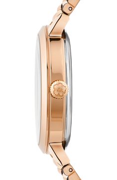 A graceful magnolia accented in a goldtone plate decorates the see-through dial of a statement-making bracelet watch that's perfect for everyday wear. 36mm case; 14mm band width Quartz movement Mineral crystal face Stainless steel with goldtone plate Made in Japan Rose Gold Automatic Watches, Rose Gold Watch With Metal Dial For Anniversary, Rose Gold Watches With Metal Dial For Anniversary, Classic Rose Gold Watch, Formal Rose Gold Jewelry And Watches With Metal Dial, Gold Watches With Rotating Bezel, Gold Watches With Rotating Bezel For Anniversary, Classic Pink Gold Watch With Subdials, Classic Pink Gold Watches With Diamond Hour Markers