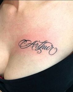 a woman's chest with the word artful written in cursive writing