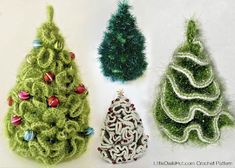 three crocheted christmas tree ornaments are shown