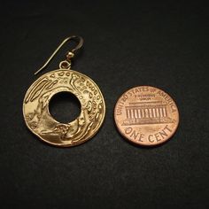 "Hand carved flying Japanese crane earrings. Throughout all of Asia, the crane has been a symbol of happiness and eternal youth. In Japanese, Chinese, and Korean tradition, cranes stand for good fortune and longevity because of its fabled life span of a thousand years. The Japanese refer to the crane as the \"bird of happiness\". The cranes' beauty and spectacular mating dances have made them highly symbolic birds in many cultures with records dating back to ancient times. Crane mythology is wid Unique Engraved Earrings As A Gift, Unique Engraved Earrings For Gift, Engraved Earrings For Gifts, Brass Medallion Earrings As A Gift, Symbolic Pierced Earrings For Anniversary, Symbolic Round Single Earring, Symbolic Single Round Earring, Gold Etched Earrings As Gift, Gold Etched Earrings For Gift