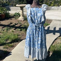 Luxology Blue &W Hits Floral Dress Flowy Stretch Waist Band Cap Flutter Ruffled Sleeves Sz Says S But Fits Larger More A M-L!! 100% Rayon Material ! It’s New Without Tags Never Worn Out Only Tried On!! Beautiful Questions? Leave A Comment Below! Blue Ruffled Sundress For Brunch, Blue Ruffled Sundress For Garden Party, Blue Tiered Sundress With Ruffle Hem, Blue Flutter Sleeve Midi Dress For The Beach, Blue Ruffled Midi Sundress, Blue Midi Dress With Flutter Sleeve For Beach, Blue Midi Sundress With Ruffles, Light Blue Cotton Midi Dress With Ruffles, Casual Blue Midi Dress With Flutter Sleeves