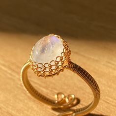 Adjustable Moonstone Crystal Ring With Open Design, Dainty Adjustable Moonstone Crystal Ring, Adjustable Mystical Moonstone Ring With Natural Stones, Adjustable Dainty Crystal Moonstone Ring, Adjustable Dainty Moonstone Crystal Ring, Adjustable Spiritual Moonstone Toe Ring, Delicate Adjustable Moonstone Ring As Gift, Handmade Adjustable Moonstone Crystal Ring, Adjustable Gold Crystal Ring With Moonstone