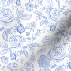 a blue and white rose print fabric with an extra length ruler in front of it