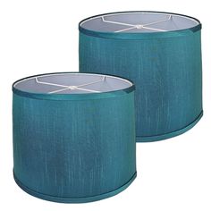 pair of teal lampshades with white trim