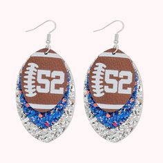 [UNIQUE DESIGN]: Customize your player's jersey number with these lightweight chunky sequin and faux leather earrings. The brown leather front layer, which is close to the football, and the flashing sequins (which can correspond to the colors of the supporting teams) are all unique designs that make people shine. [EXCLUSIVELY MADE]: Stainless steel ear hooks, a pendant made of PU material, fashion style, worn during rugby games to cheer for favorite players. [PERFECT GIFT]: Makes the perfect gif Number Earrings, Rugby Games, Big Statement Earrings, Diy Leather Earrings, Football Earrings, Mom Accessories, Football Lover, Perfect Gif