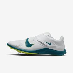 the nike zoom golf shoe is white and green