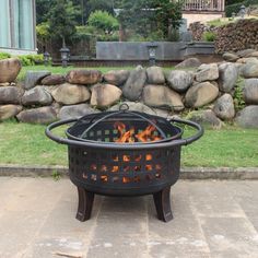 a fire pit sitting in the middle of a yard