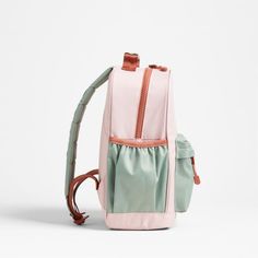 A backpack that's extra comfy and ready to handle all the adventures of the day. Combining colorblocks of candyfloss pink and mint green with pops of coral trim, the kids' medium knapsack is constructed of supremely durable polyester made from recycled water bottles. A roomy interior holds everything your kid needs-books, school supplies, extra layers-and there's a padded pocket to keep their tablet protected. Outside pockets hold snacks, water bottles and more. Pair this book bag with the match Pink Lunch Box, Books School, Monogram Backpack, Kids School Backpack, Pink And Mint, Box Water, Medium Backpack, Kids Backpack, Clothes Pictures