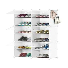 a white shoe rack with many pairs of shoes