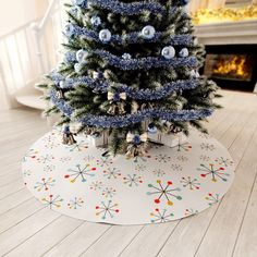 a blue christmas tree with ornaments on it