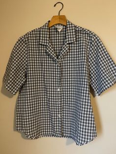 Vintage plaid shirt sleeve shirt by Bonworth.  Black and white.  Polyester and cotton. Medium.  Arm pit= 23 Length = 25 Plaid Cotton Button-up Blouse, Cotton Gingham Top For Daywear, Classic Plaid Shirt For Daywear, Gingham Cotton Short Sleeve Shirt, Relaxed Fit Gingham Button-up Shirt, Plaid Cotton Collared Blouse, Gingham Cotton Shirt For Work, Relaxed Fit Gingham Cotton Top, Relaxed Fit Cotton Gingham Tops