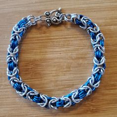 Silver And Pacific Blue Hand Crafted Chain Mail Bracelet Measuring 8.5" Long And 1/4" Wide. Toggle Clasp Closure. New, Never Worn. Great Unisex Accessory For Ren Faires And Festivals! Chainmail Bracelet, Blue Hand, Pacific Blue, Chain Mail, Unisex Accessories, Toggle Clasp, Womens Jewelry Bracelets, Blue And Silver, Hand Crafted