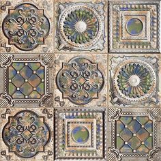 an intricately designed ceiling tile with many different colors and designs on the tiles,