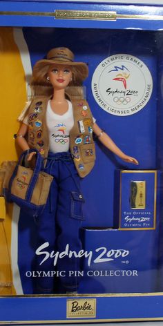 a barbie doll in a box with the olympic pin collector