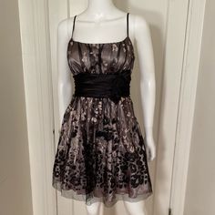 Stunning Taupe And Black Glitter Dress With Satin Bow-Tie. Side Zipper. Adjustable Straps. New Without Tags. All Sales Final Elegant Black Glitter Evening Dress, Black Shimmer Dress For Prom, Black Shimmer Dresses For Prom, Elegant Black Glitter Dress, Black Shimmer Dress For Formal Occasions, Black Shimmer Formal Dress, Chic Black Shimmer Dress, Chic Shimmer Mini Dress For Formal Occasions, Sleeveless Glitter Dress For Formal Events