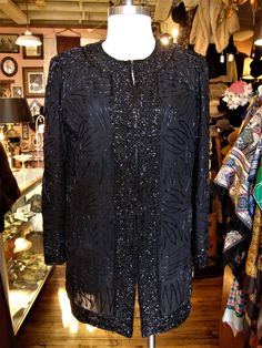 "This is a vintage beaded evening jacket by Brilliante from the 1980's or 90's. It closes down the front with sets of hooks and eyes, is lined and has removable shoulder pads. Great for the holidays! It's in great condition! Comes from a smoke free home. Measurements: Bust: 38\" Waist: 38\" Hip: 40\" Across Shoulder: 15\" Sleeve Length: 23\" Length from Shoulder: 31.5\" Please ask me any questions you may have before buying as this is a final sale. Please know your measurements and allow for mov Embellished Holiday Outerwear For Evening Events, Holiday Evening Embellished Outerwear, Glamorous Beaded Outerwear For Evenings, Glamorous Beaded Evening Outerwear, Vintage Sequin Outerwear For Night Out, Vintage Beaded Evening Outerwear, Beaded Evening Outerwear For Winter, Beaded Winter Evening Outerwear, Vintage Beaded Party Outerwear