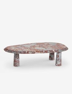 a marble coffee table with two legs and an oval shaped design on the top, against a white background