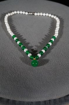 I am offering you this exquisite vintage 18 K whit gold plated (closure) (stamped) bold genuine combination green jade and cultured pearl tennis lavaliere style single strand necklace. It measures app. 18 inches long. This necklace came from an estate here in upstate New York. What fabulous, classic presentation of cultured pearls this is. It is simply breath taking! There is individual knotting in between each stone. It measures a very versatile 18 inches long, this is a spectacular piece. The Tennis Style, Green Jade, Pearl Chain, Style Necklace, Jade Green, Silver Wedding, Strand Necklace, Cultured Pearls, Eternity Bands