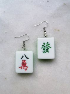 Mahjong tile earnings. Popular Chinese game converted into beauty earrings set. Elegant tiles and silver findings make theese jewelry unique and memorable. Great as a gift for all Asia, orient or mind game lovers. W E L C O M E Welcome to Piranha Unique Jewelry! Thank you for visiting our shop. We are glad you found your way here. If you have any questions, please do not hesitate to contact us! We're more than happy to help. P R O D U C T ∙ I N F O Ear wires (standard): Hypoallergenic Surgical S Elegant Tiles, Cute Earrings, Unique Earrings, Solid 925 Sterling Silver, Earring Set, My Jewellery, Jewelry Earrings Dangle, Dangle Drop Earrings, How To Memorize Things