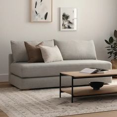 a living room scene with focus on the couch and coffee table