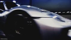 a close up of a sports car in motion