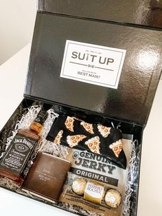 a gift box with pizza, liquor and other items