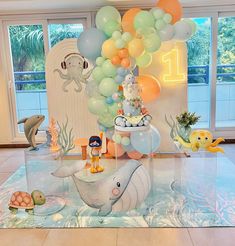 an ocean themed birthday party with balloons and decorations