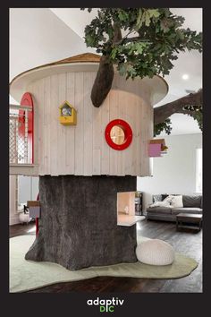 the tree house is made from an old tree stump