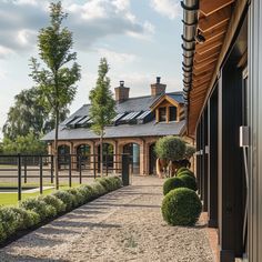 an outside view of a horse stable and its stables