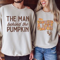 "💖 Surprise your family and friends with these cute and funny matching couples football pregnancy announcement sweaters!  These super cozy sweaters are ideal for fall weather and football season. Dress your baby bump and beer belly in style and get ready for some funny reactions when you debut your pregnancy in this football-loving couple's look. Order yours today! 👕 PRODUCT INFO This unisex heavy blend crewneck sweatshirt and hoodie are pure comfort. These garments are made from polyester and cotton. This combination helps designs come out looking fresh and beautiful. The collar is ribbed knit, so it retains its shape even after washing. .: 50% cotton, 50% polyester .: Medium-heavy fabric (8.0 oz/yd² (271.25 g/m .: Loose fit .: Sewn-in label .: Runs true to size ✏️ DESIGN Designs are pr Football Pregnancy Announcement, Couples Football, Pumpkin Pregnancy Announcement, Funny Reactions, Funny Matching, Pumpkin Sweatshirts, Couples Sweatshirts, Pregnancy Reveal, Baby Reveal