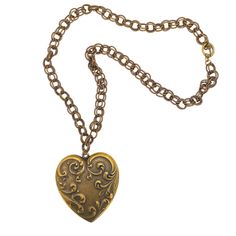 This heart necklace features a large vintage inspired heart medallion. the necklace is 22" in length and closes with a toggle clasp. The heart is 2.25" wide and 2.5" in length. It is perfect for anyone who loves vintage and also the cottagecore look. Vintage Heart Pendant, Victorian Heart Necklace With Heart Charm, Vintage Heart Charm Medallion Jewelry, Vintage Jewelry With Heart Charm Medallion, Vintage Heart Necklace With Lobster Clasp For Valentine's Day, Vintage Necklaces With Vintage Charm For Valentine's Day, Vintage Gold Heart Metal Necklace, Vintage Antique Gold Jewelry With Heart Charm, Victorian Brass Necklace With Heart Charm