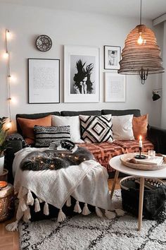 a living room filled with lots of furniture and pictures on the wall above it's coffee table