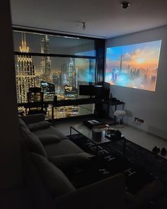 a living room filled with furniture and a flat screen tv mounted to the side of a wall